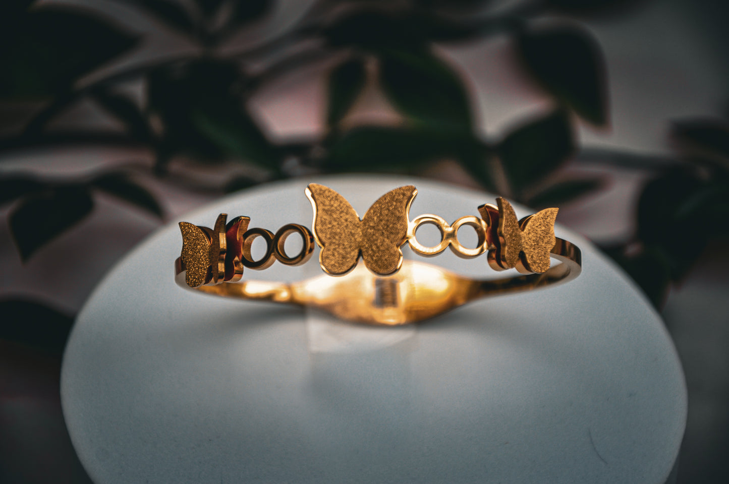 Gold butterfly bracelet, elegant design, made of high-quality metal, perfect for stylish accessories.