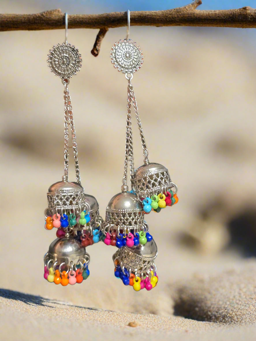 Colorful silver jhumka earrings with vibrant bead accents, perfect for bohemian style jewelry.