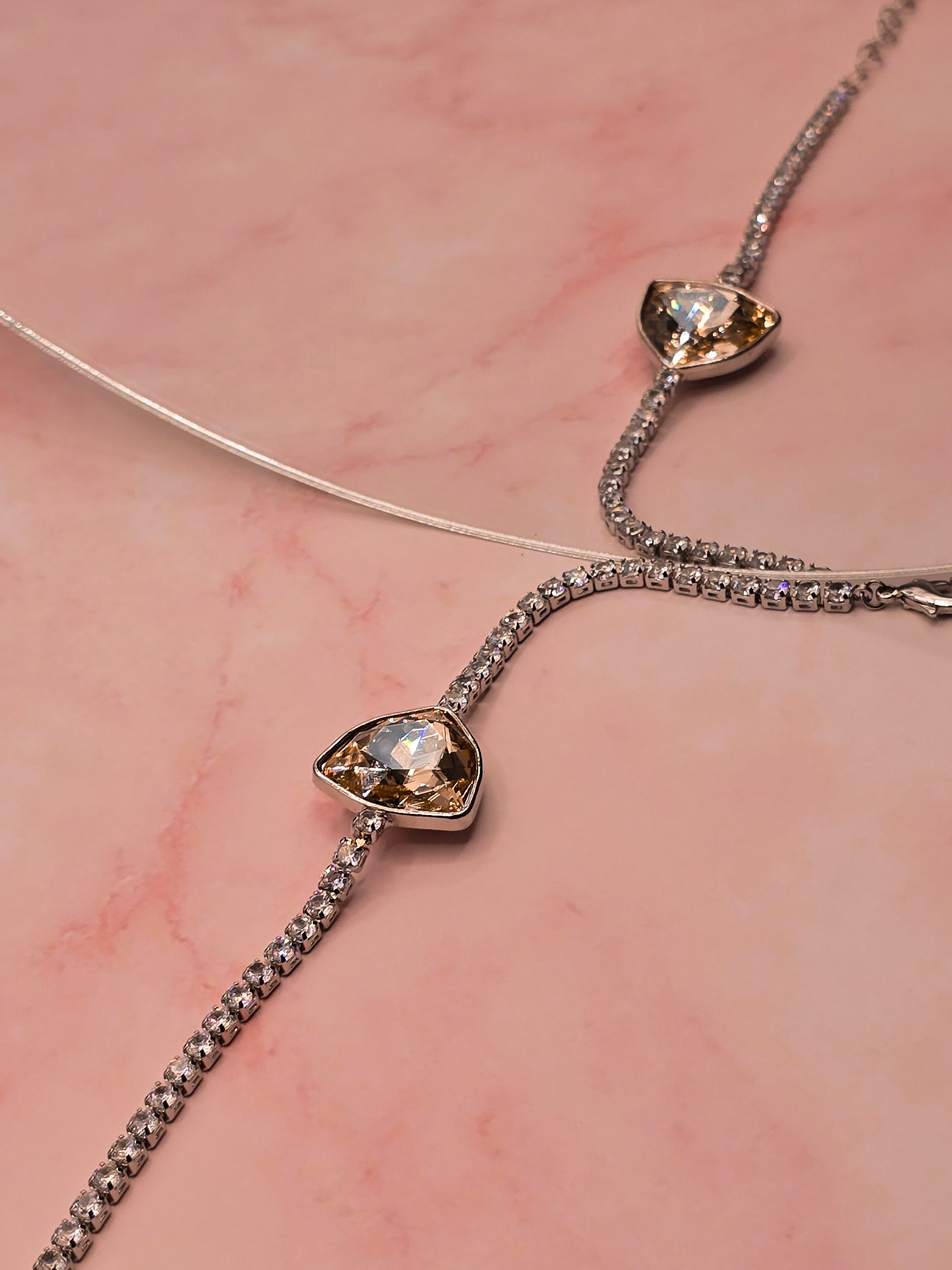 Elegant silver chain bracelet with a sparkling champagne diamond centerpiece.