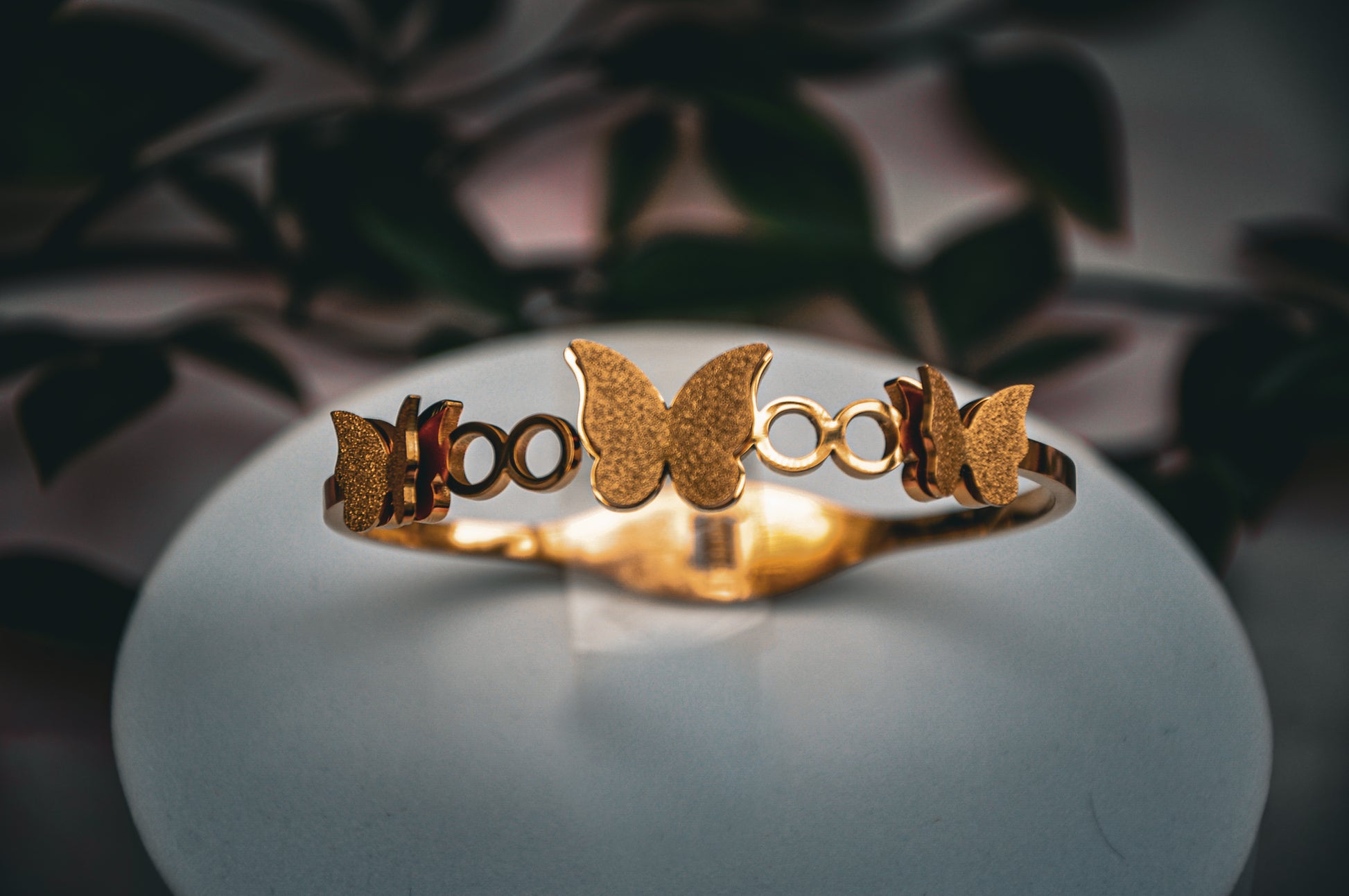 Gold butterfly bracelet, elegant design, made of high-quality metal, perfect for stylish accessories.
