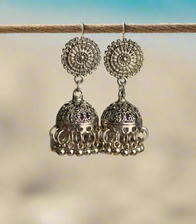 Antique silver chandelier earrings with intricate filigree design and beaded detailing.