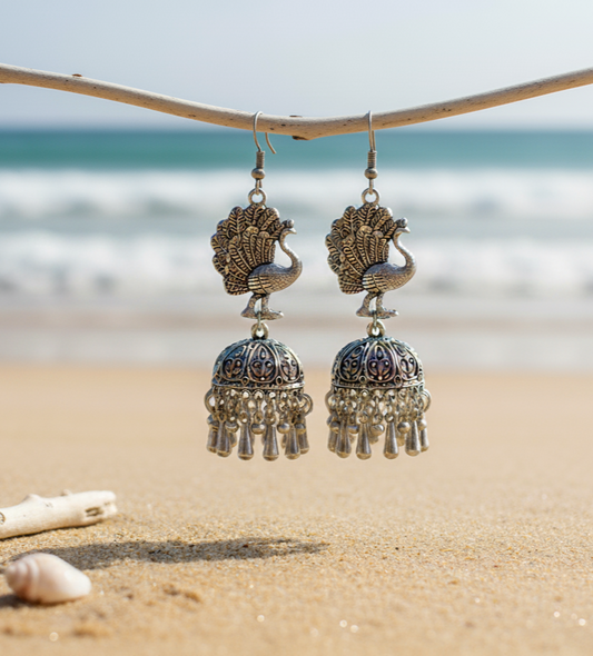 Beautiful silver peacock earrings with jhumka design, detailed and elegant, perfect for any occasion.