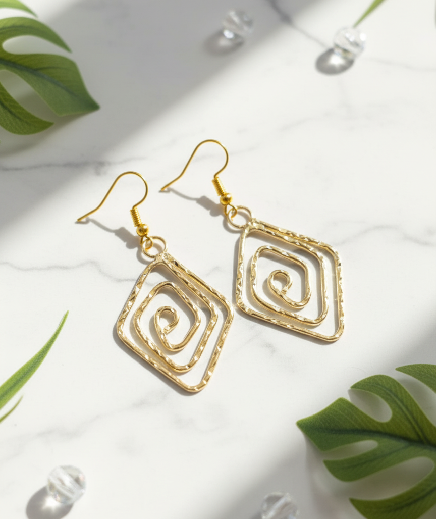 Gold spiral design earrings, handcrafted, lightweight metal, elegant and stylish for any occasion.