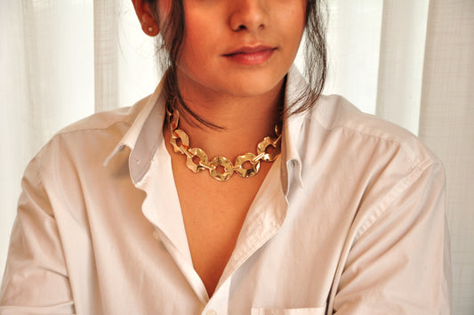 Gold chain necklace featuring a bold link design, ideal for enhancing any outfit.