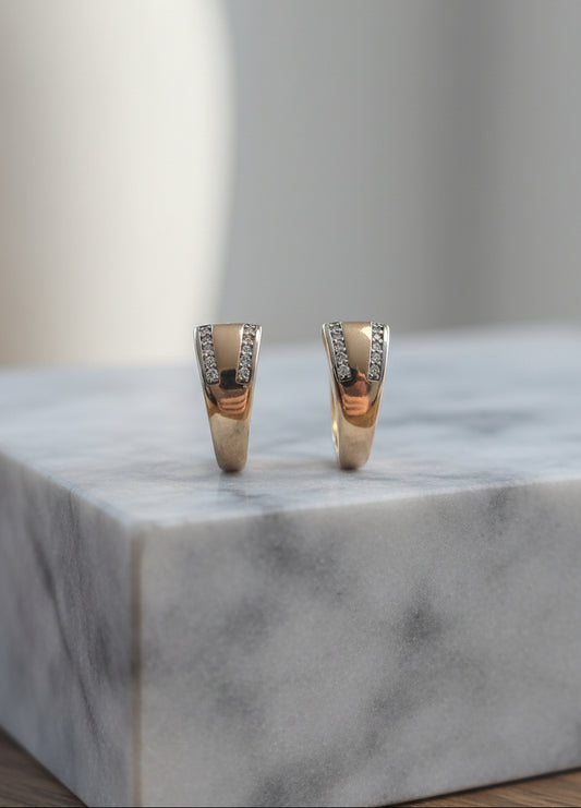 Elegant gold hoop earrings with diamond accents, perfect for any occasion.