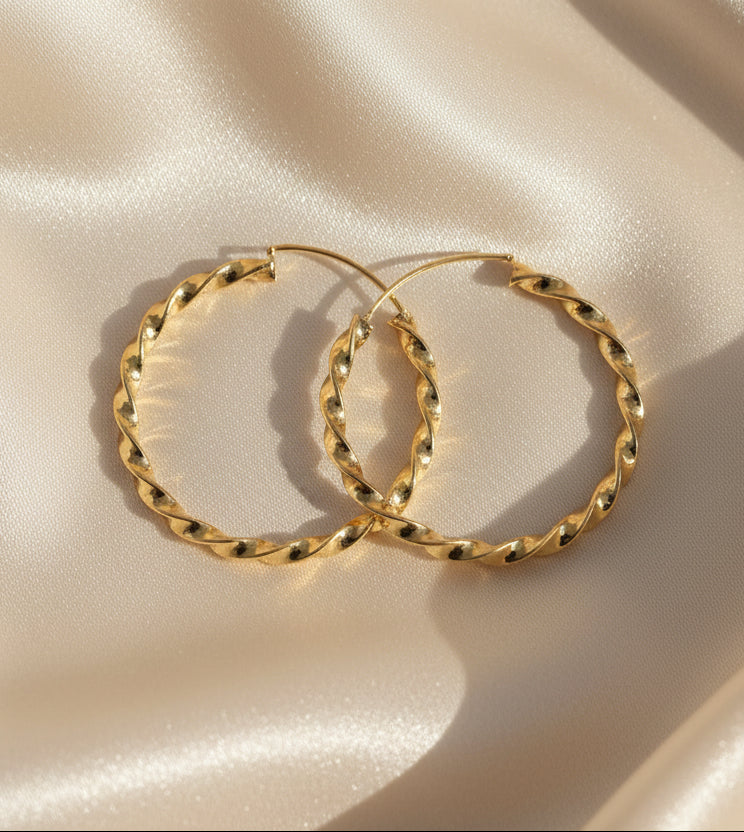 Twisted gold hoop earrings, elegant style, perfect for any occasion.