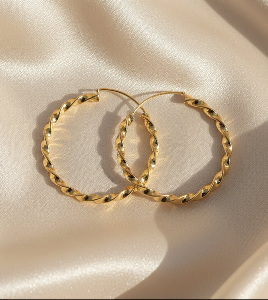 Twisted gold hoop earrings, elegant style, perfect for any occasion.