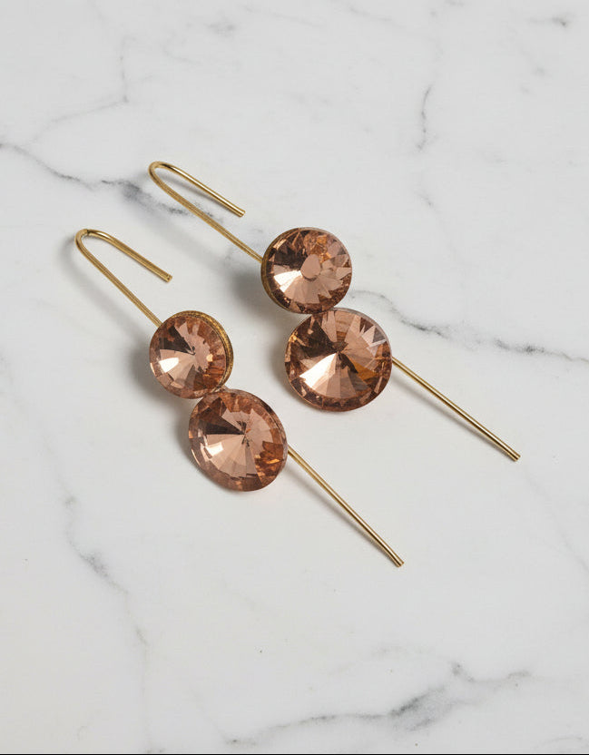 Elegant rose gold drop earrings with sparkling circular crystals, perfect for special occasions.