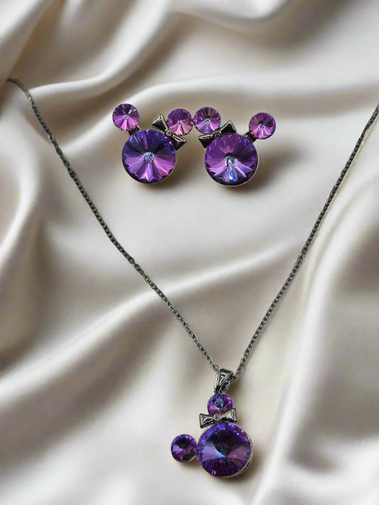 Purple crystal necklace and earrings set with bow detail on silver chain, perfect for stylish accessories.