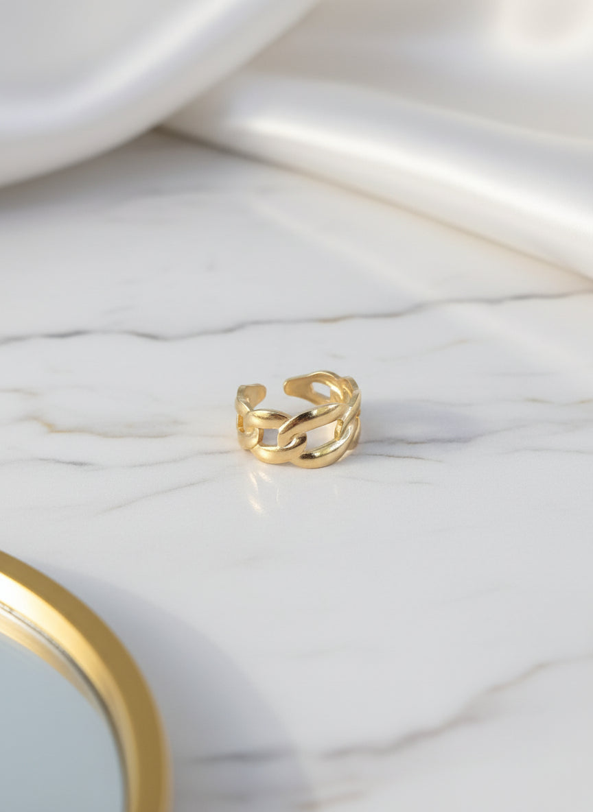 Gold chain link ring made of durable metal, featuring a stylish open design and modern look.